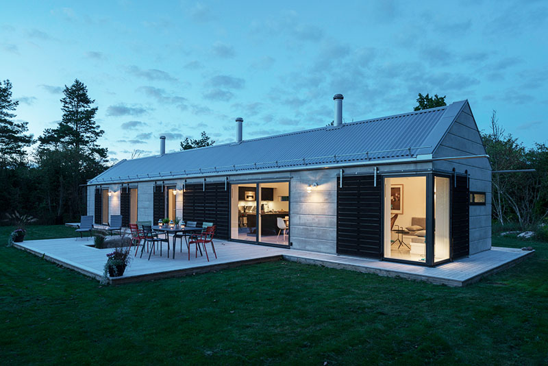 A modern holiday home, built with prefabricated concrete elements, and inspired by the simple forms of traditional barns.